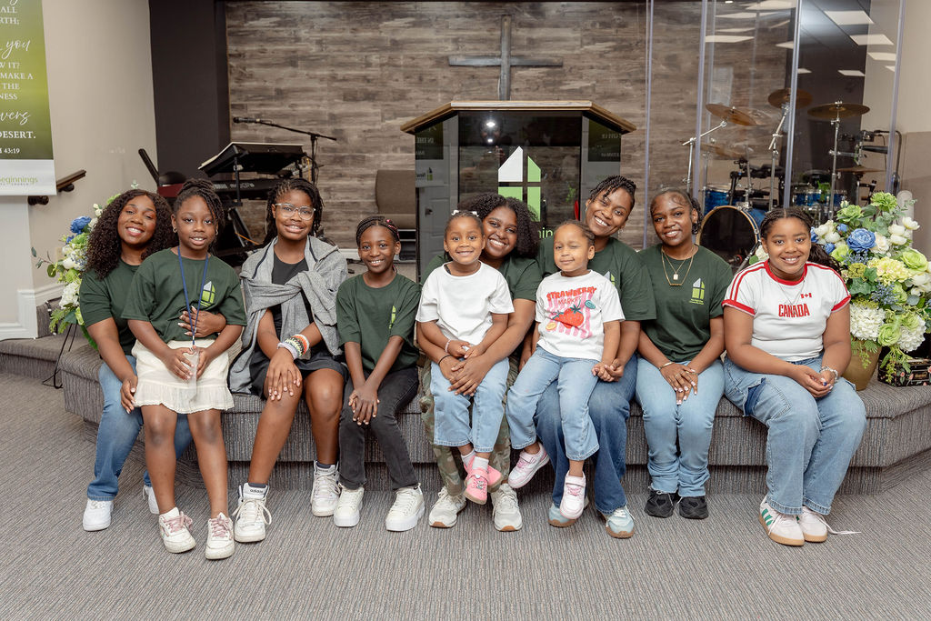 Girls and young women of the children's ministry seated together at the front of the sanctuary
